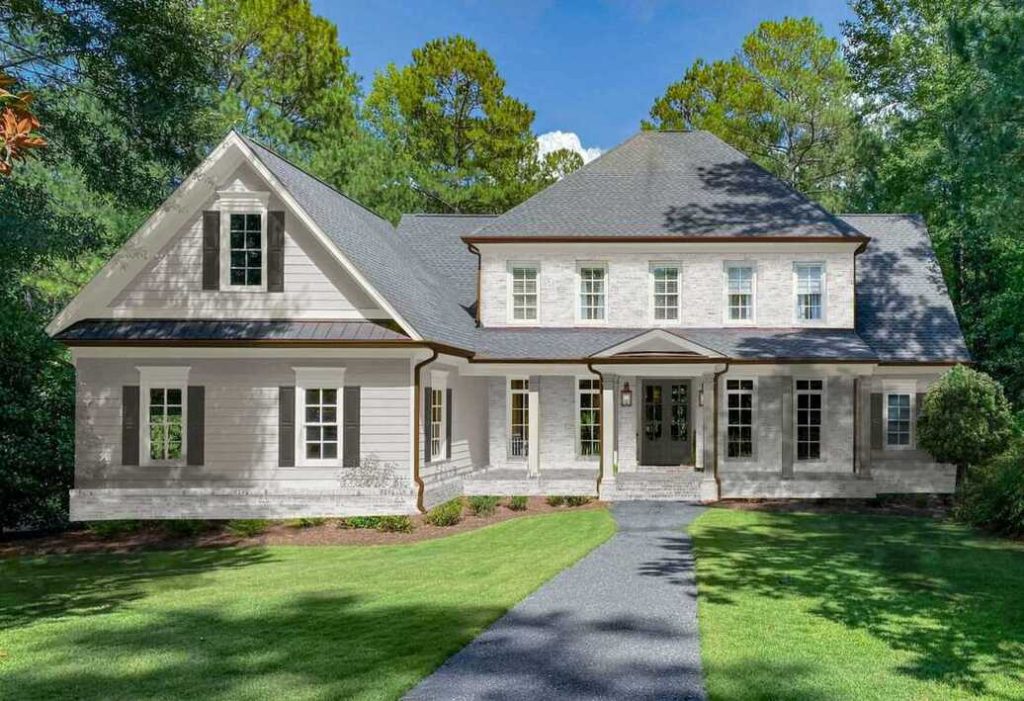 Classic home with whitewashed brick and vinyl siding