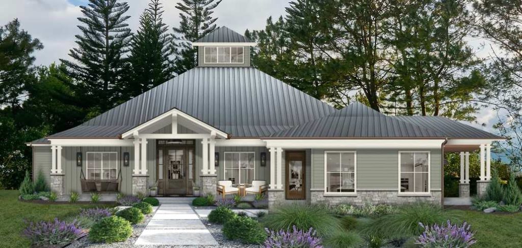 White and green home exterior with stone accents